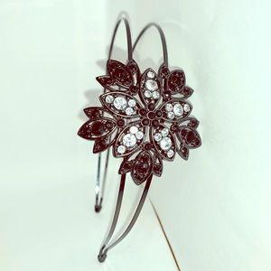 Bands 2 for $10. Metal silver headband with flower